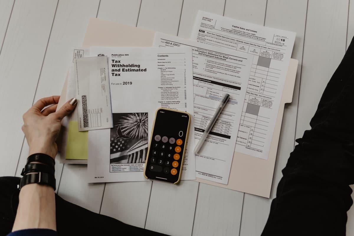 Calculator and financial planning documents for a personalised quote